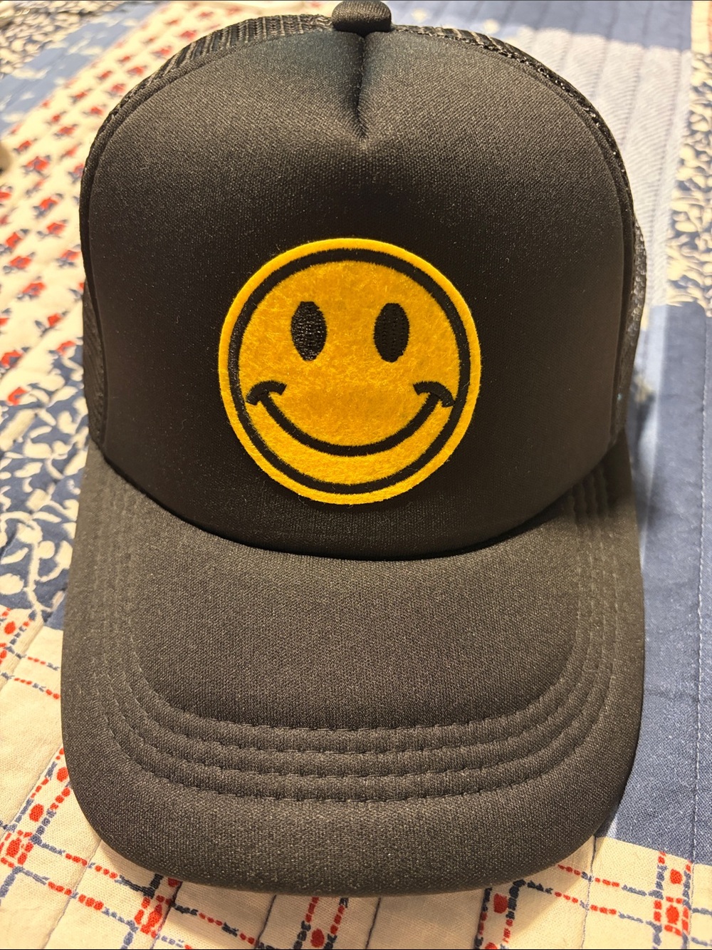 Black Trucker Cap with Yellow Smiley Patch